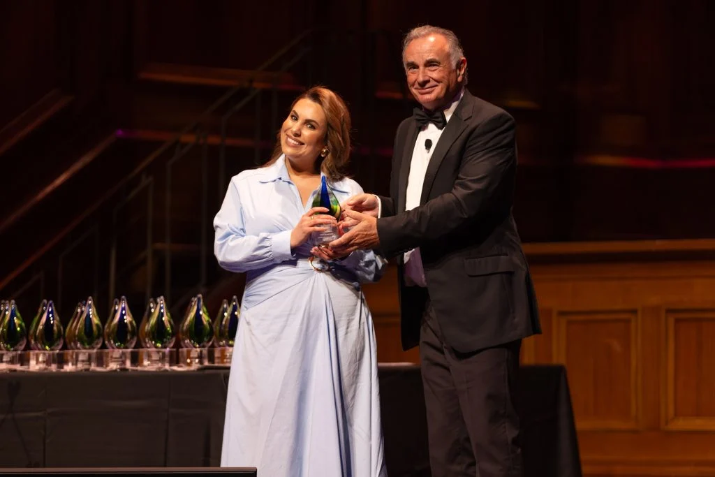 Roula accepting an award at the Australian Dentistry Awards 2025
