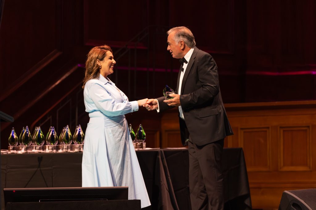 Roula accepting an award at the Australian Dentistry Awards 2025